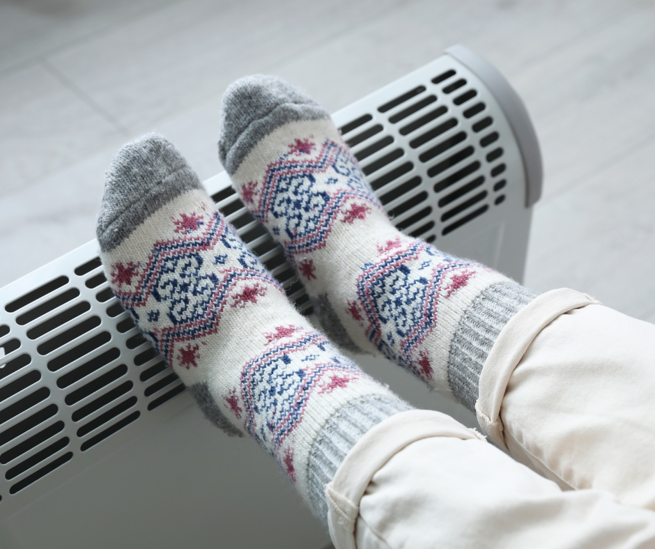 Cold feet in socks ontop of heater