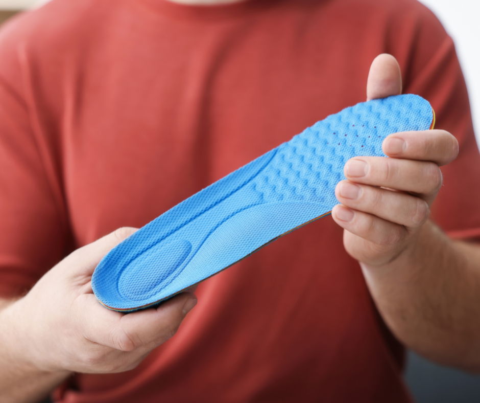 Man holding orthotic