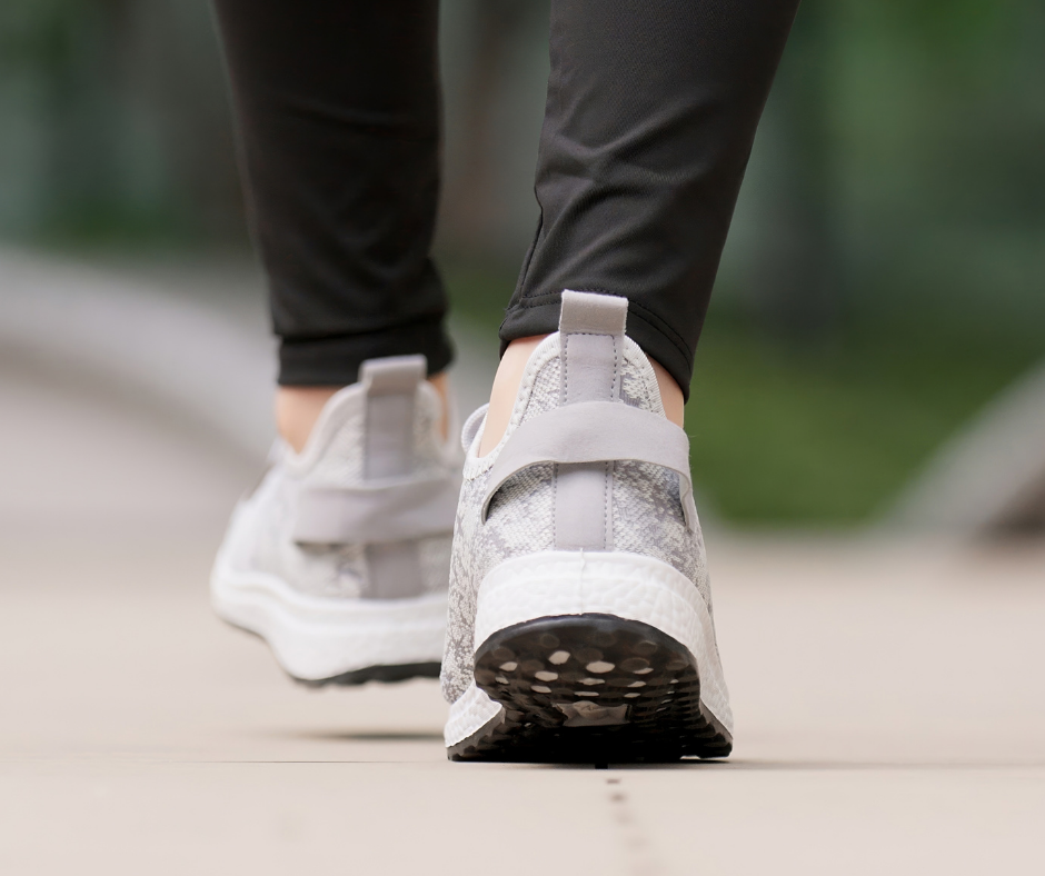 feet walking on sidewalk